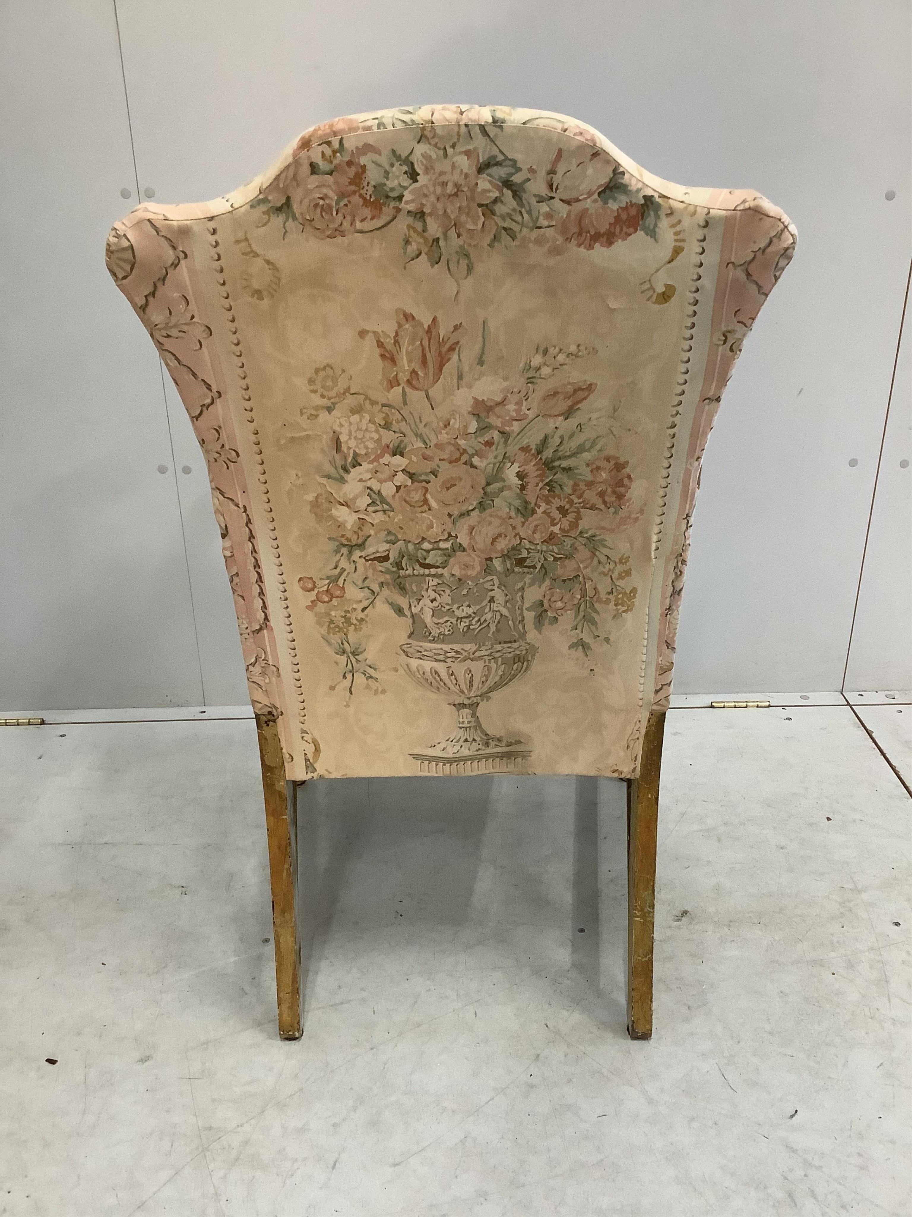 A French giltwood and tapestry open armchair, width 58cm, depth 56cm, height 102cm. Condition - fair to good